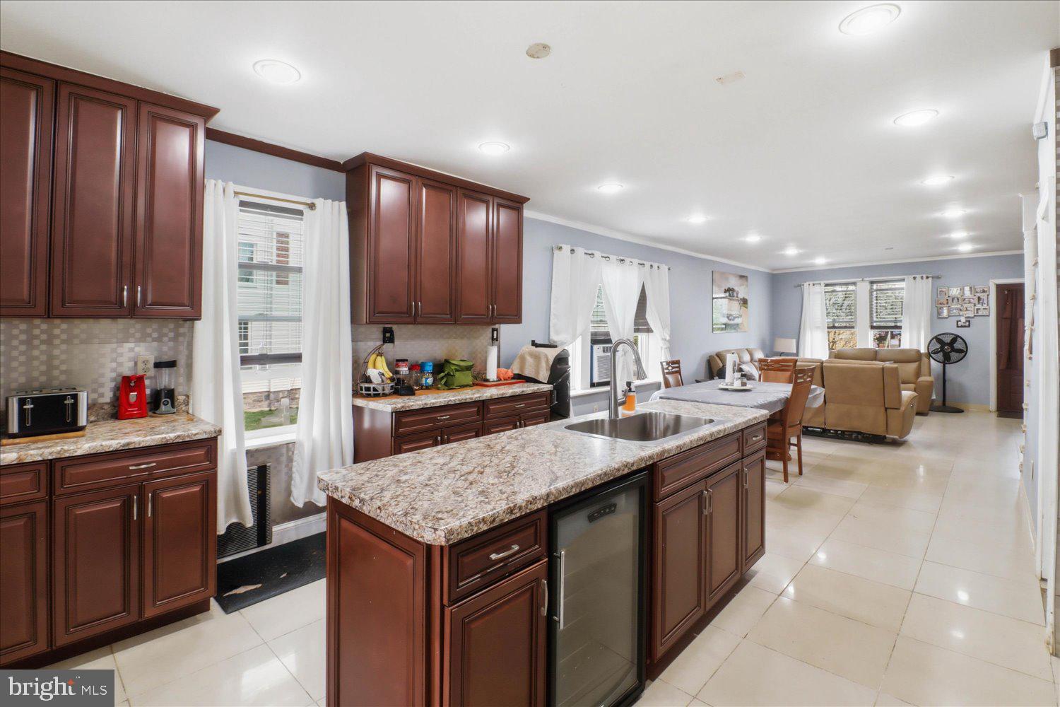 875 Manor Street Lancaster, PA 17603 - Photo 13 of 54 a kitchen with counter top space cabinets and center island