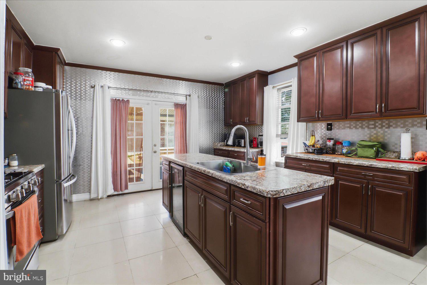 875 Manor Street Lancaster, PA 17603 - Photo 16 of 54 a kitchen with stainless steel appliances granite countertop a sink stove and refrigerator
