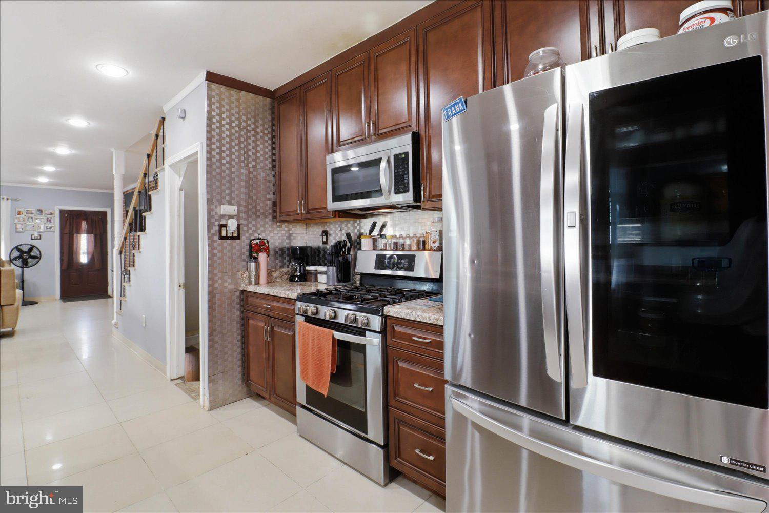 875 Manor Street Lancaster, PA 17603 - Photo 17 of 54 a kitchen with stainless steel appliances granite countertop a refrigerator and a stove