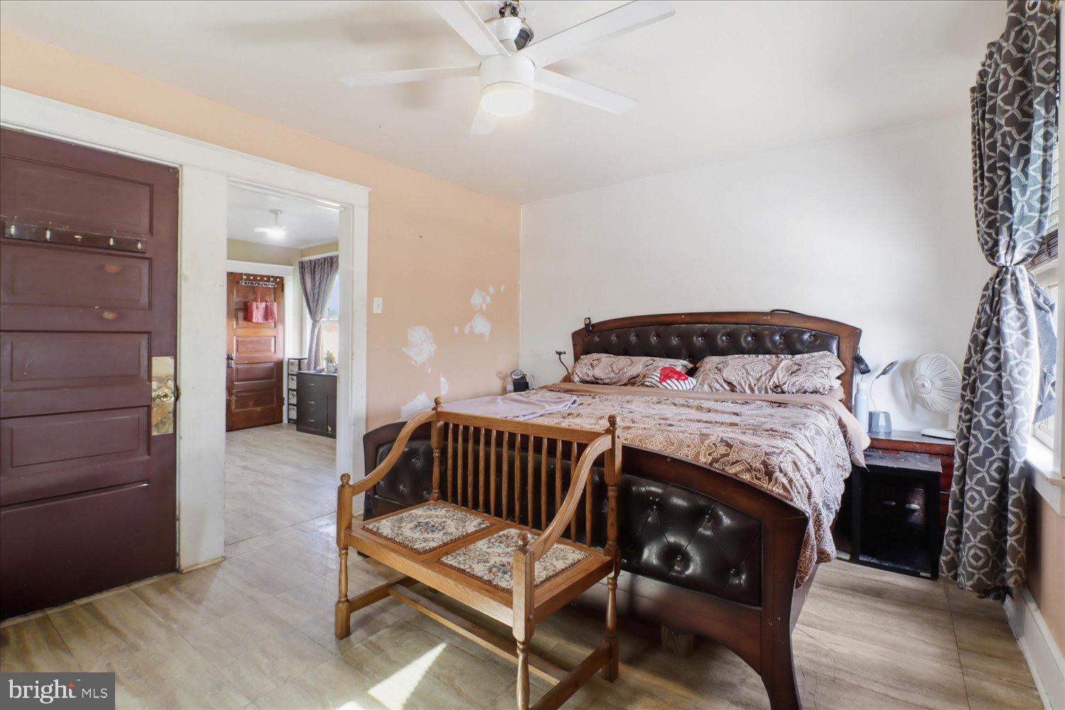 875 Manor Street Lancaster, PA 17603 - Photo 20 of 54 a bedroom with a bed and wooden floor