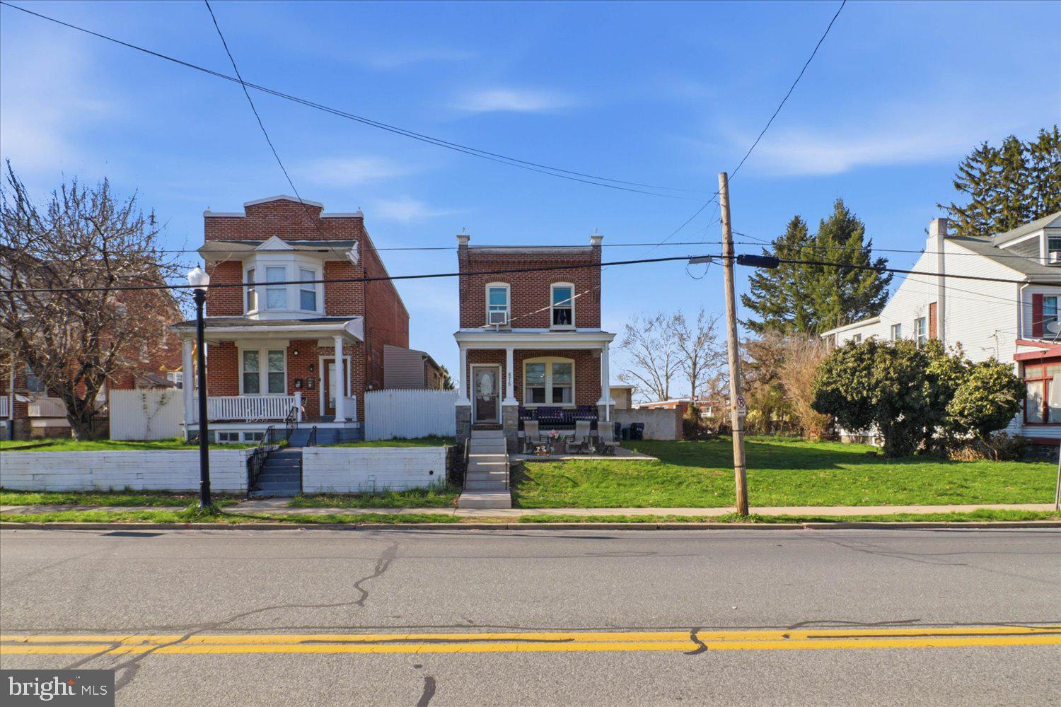 875 Manor Street Lancaster, PA 17603 - Photo 2 of 54 a front view of a house with garden