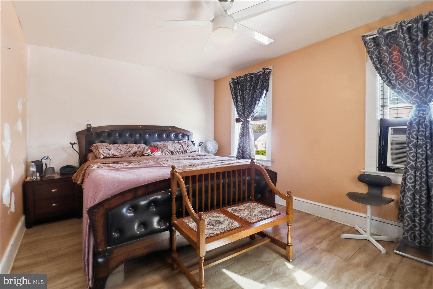 875 Manor Street Lancaster, PA 17603 - Photo 21 of 54 a bedroom with a bed and wooden floor