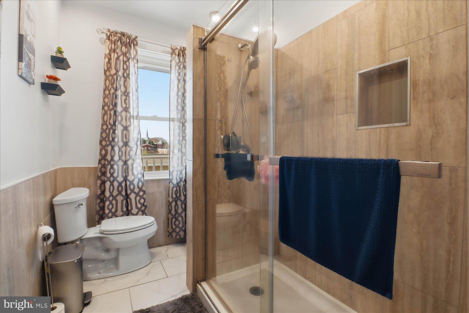 875 Manor Street Lancaster, PA 17603 - Photo 27 of 54 a bathroom with a toilet and shower