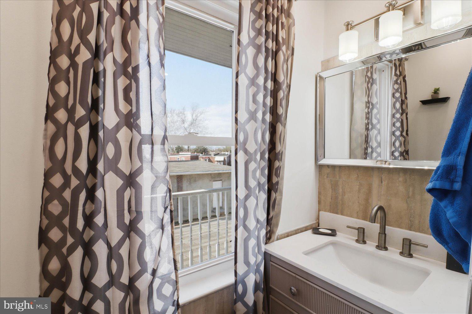875 Manor Street Lancaster, PA 17603 - Photo 28 of 54 a bathroom with a sink and a mirror