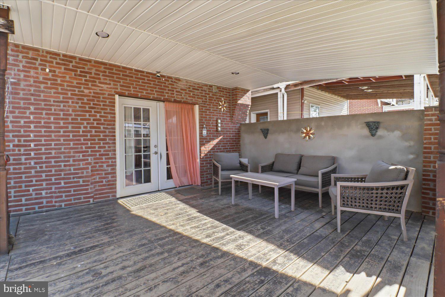 875 Manor Street Lancaster, PA 17603 - Photo 41 of 54 a backyard of a house with wooden floor and outdoor seating