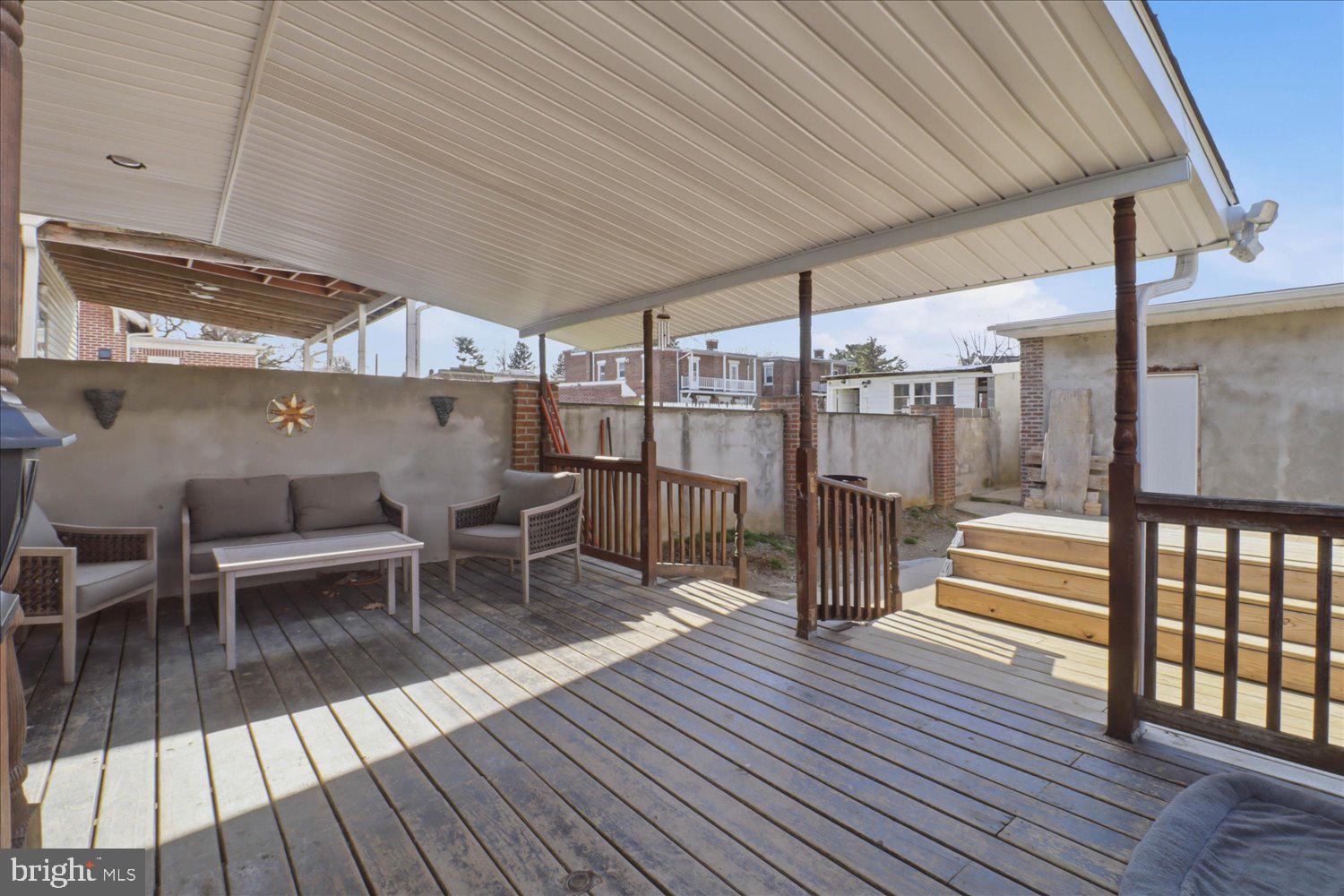 875 Manor Street Lancaster, PA 17603 - Photo 42 of 54 a view of a patio with table and chairs wooden floor and fence