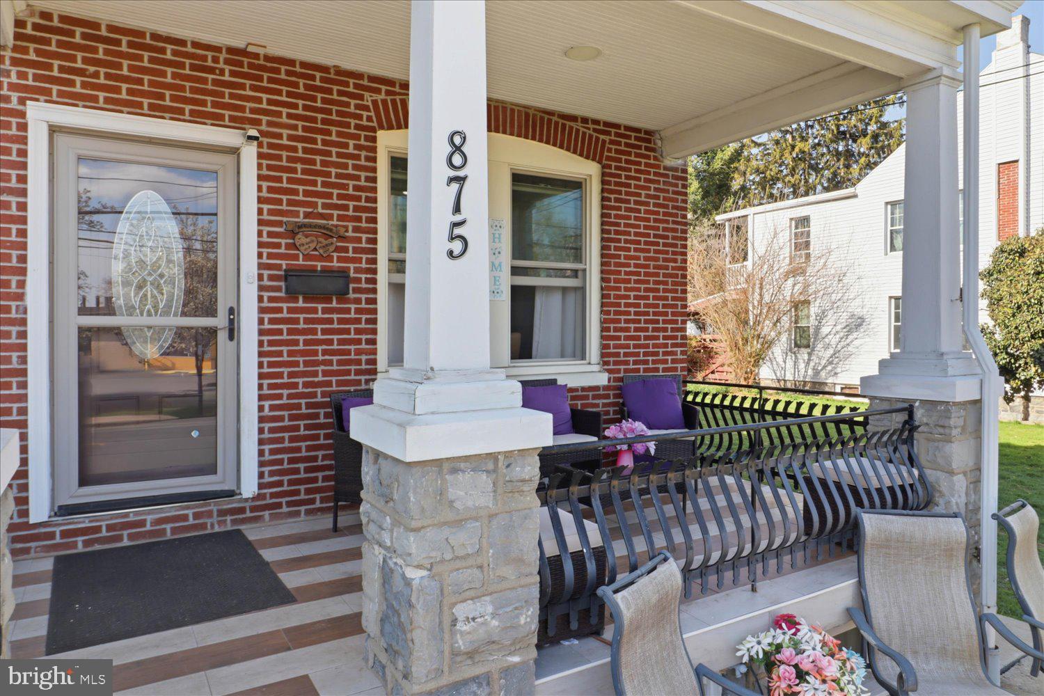 875 Manor Street Lancaster, PA 17603 - Photo 6 of 54 a view of a patio with two chairs and a potted plant