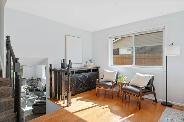 a view of a livingroom with furniture and a window