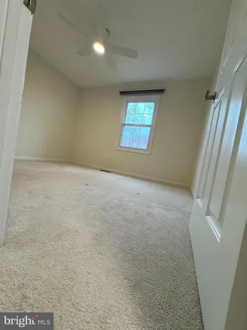 a view of an empty room and closet