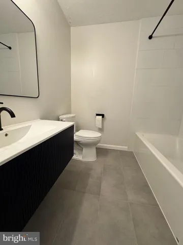 a view of a livingroom with furniture wooden floor and window