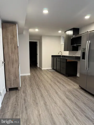 a bathroom with a shower and a sink