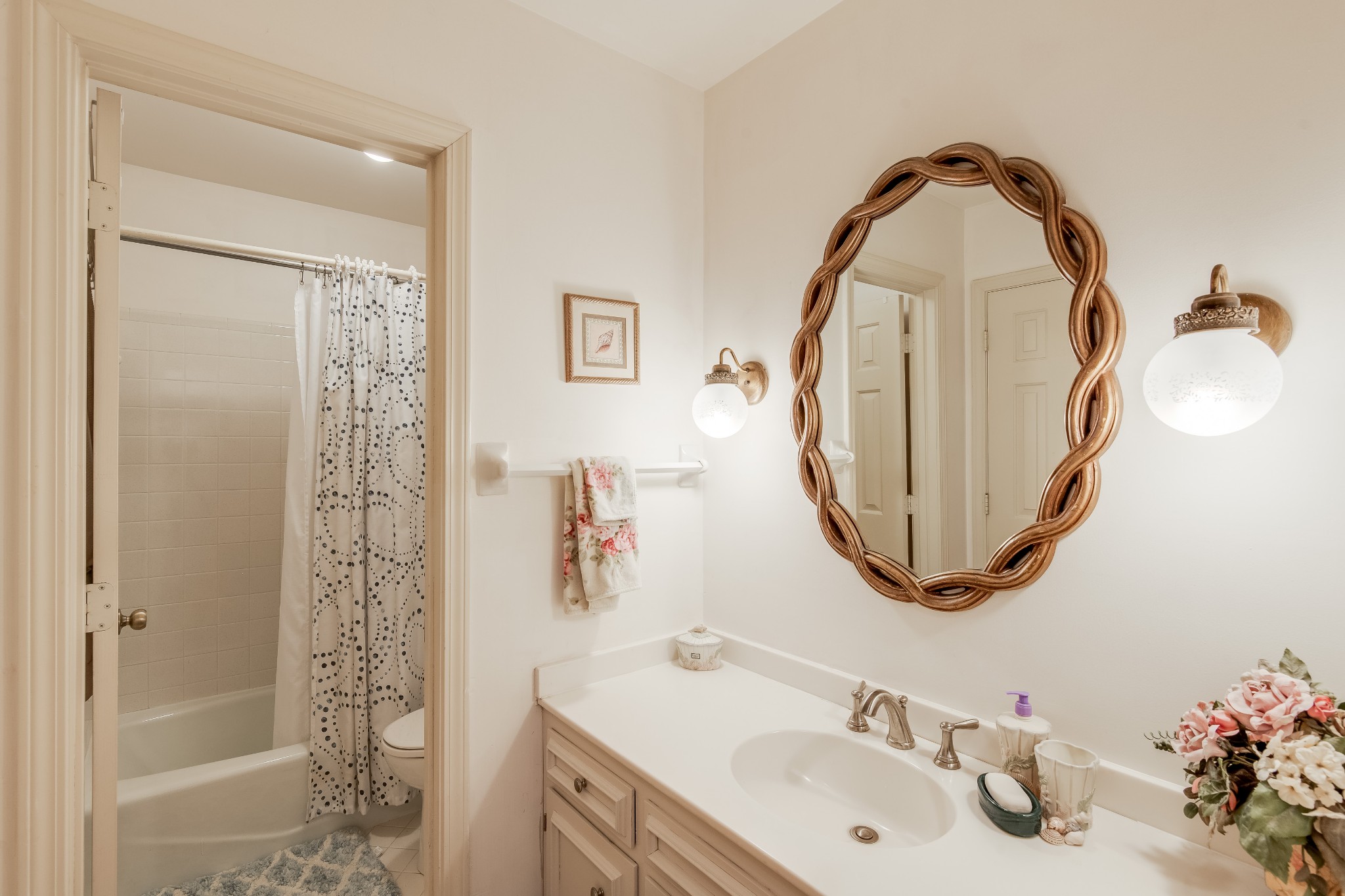 822 General George Patton Road Nashville, TN 37221 - Photo 15 of 16 a bathroom with a sink a toilet and a mirror