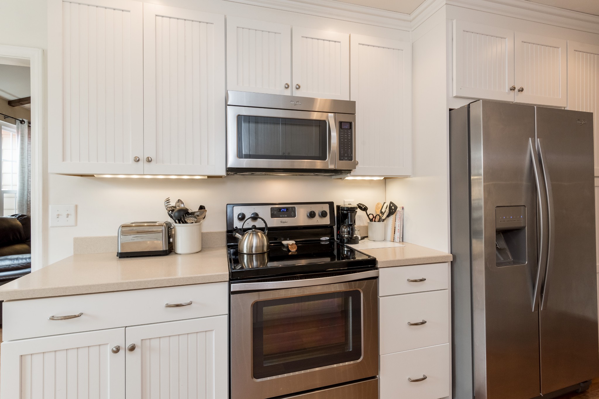 822 General George Patton Road Nashville, TN 37221 - Photo 5 of 16 a kitchen with stainless steel appliances granite countertop white cabinets a refrigerator and a stove top oven