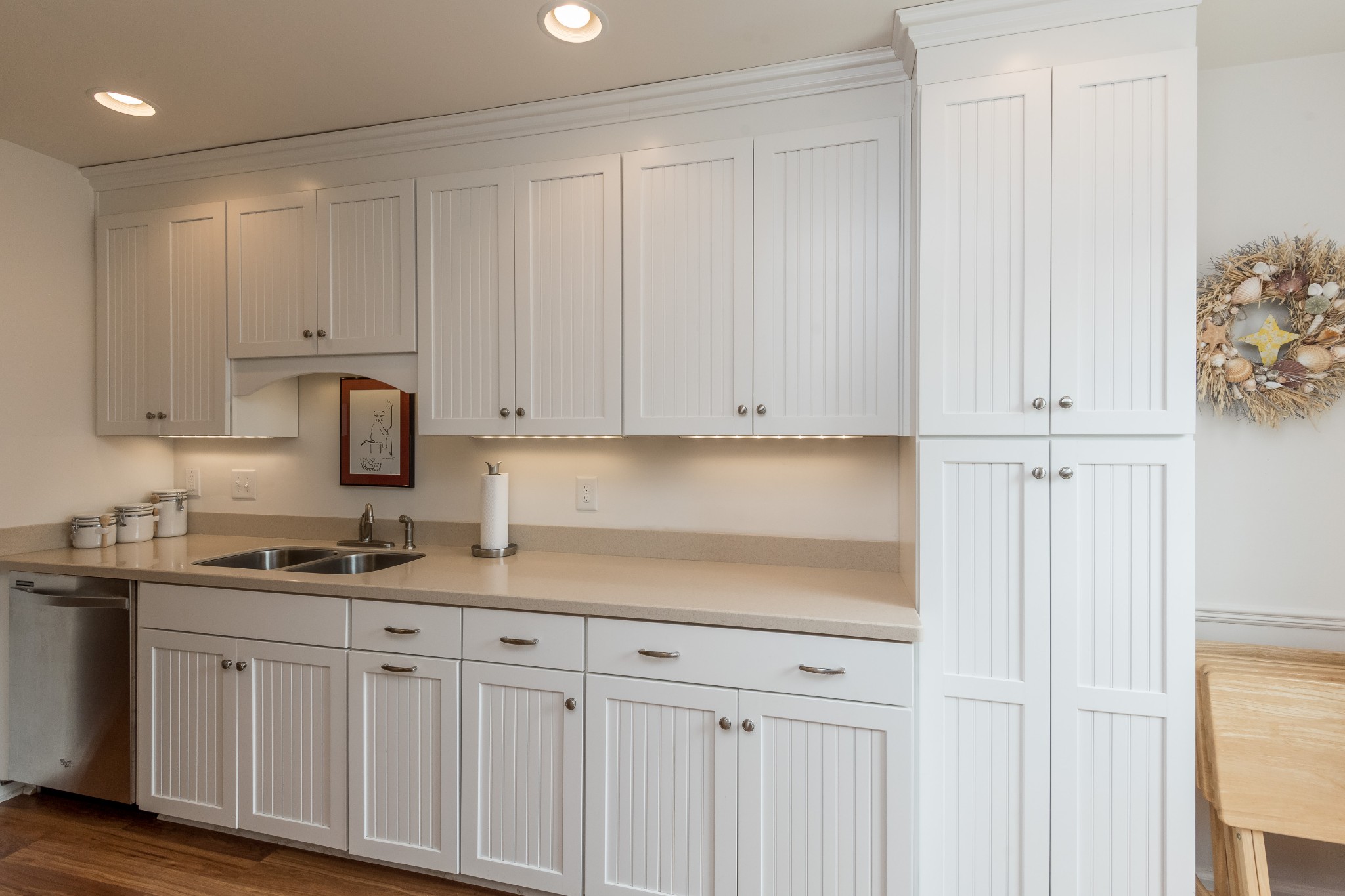 822 General George Patton Road Nashville, TN 37221 - Photo 6 of 16 a kitchen with white cabinets and a sink