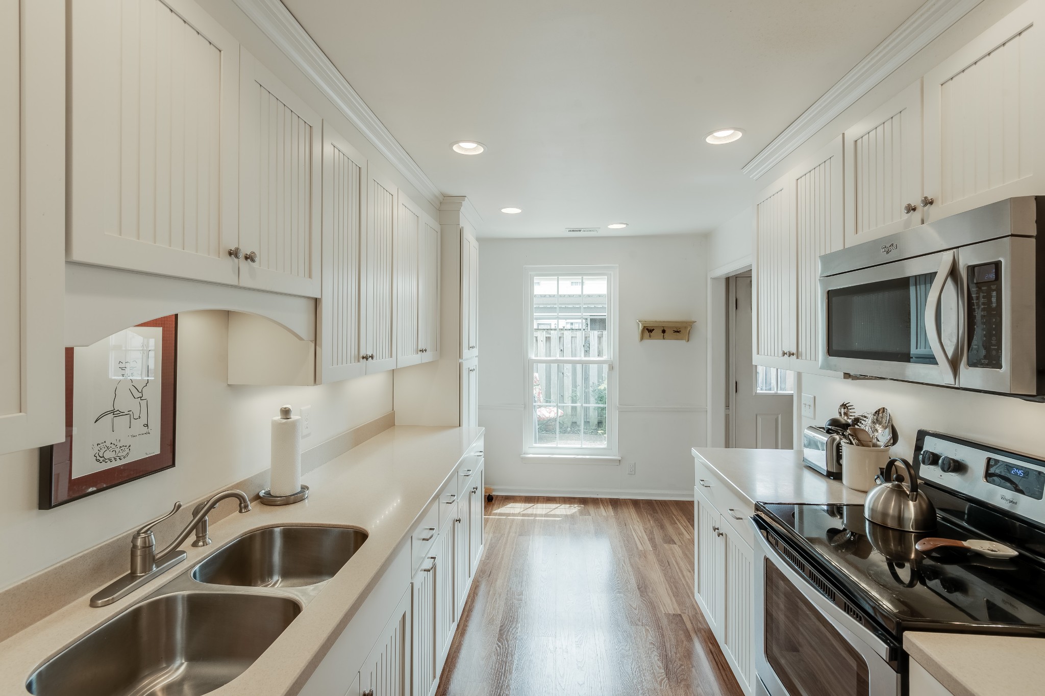 822 General George Patton Road Nashville, TN 37221 - Photo 7 of 16 a kitchen with a sink stove top oven and microwave