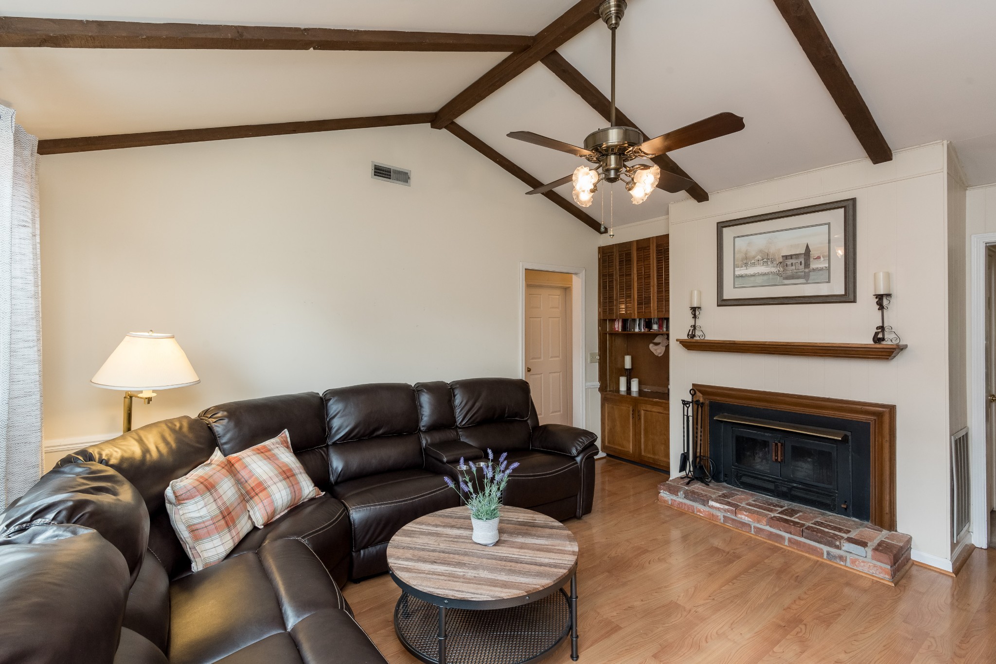 822 General George Patton Road Nashville, TN 37221 - Photo 8 of 16 a living room with furniture a fireplace and a ceiling fan