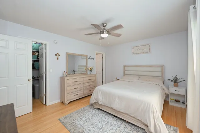 a bedroom with a bed and a dresser