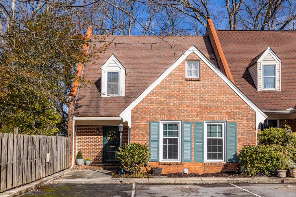 218 Forkner Drive, Unit J Decatur, GA 30030 - Photo 1 of 1 a front view of a house with garden