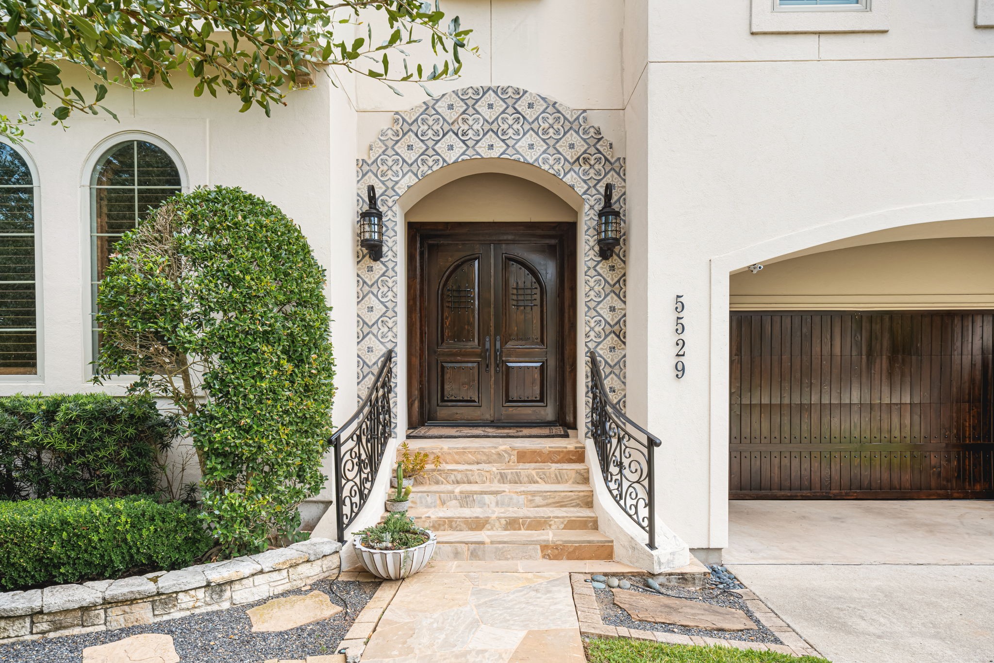 5529 Jessamine Street Houston, TX 77081 - Photo 2 of 37 a front view of a house with a garden