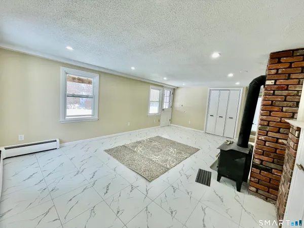 a view of an empty room and staircase