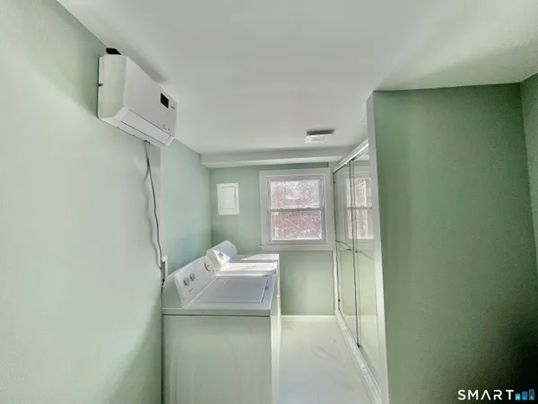 a bathroom with a glass shower door