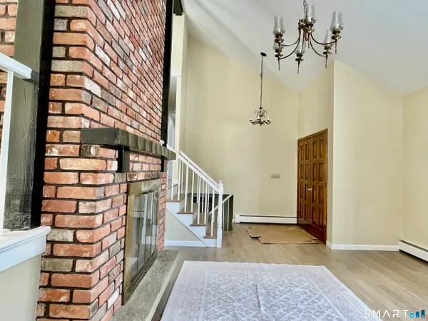a view of entryway with a front door