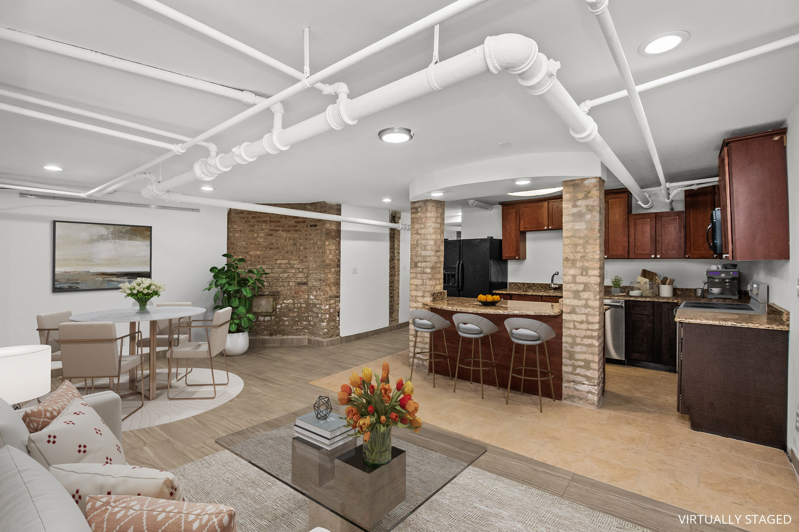 823 East Drexel Square Chicago, IL 60615 - Photo 2 of 3 a kitchen with stainless steel appliances kitchen island granite countertop a refrigerator a stove a sink dishwasher a dining table and chairs with wooden floor