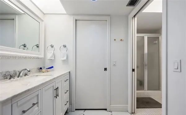 a bathroom with a sink and a mirror