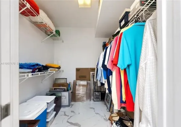 a view of a closet with storage