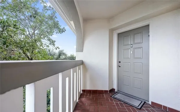 a view of balcony and yard