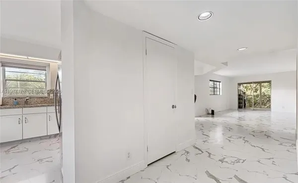 a view of a bathroom with sink and mirror