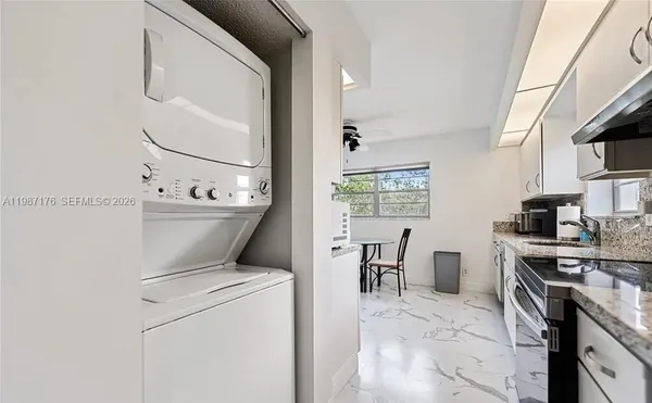 a view of washer and dryer near a kitchen