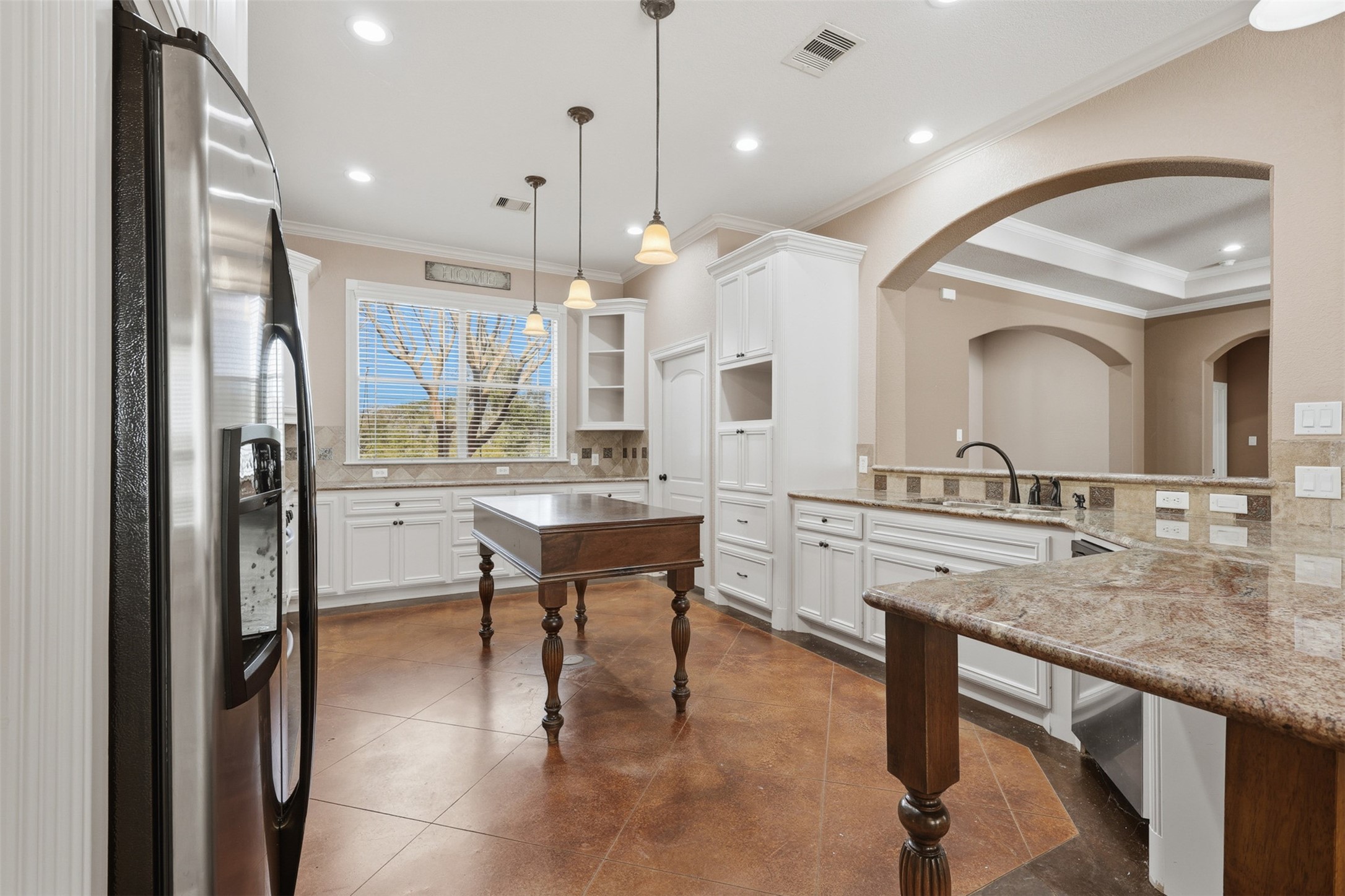 500 Burwell Road Highlands, TX 77562 - Photo 12 of 50 Bright kitchen featuring granite countertops, crisp white cabinets, and ample workspace.