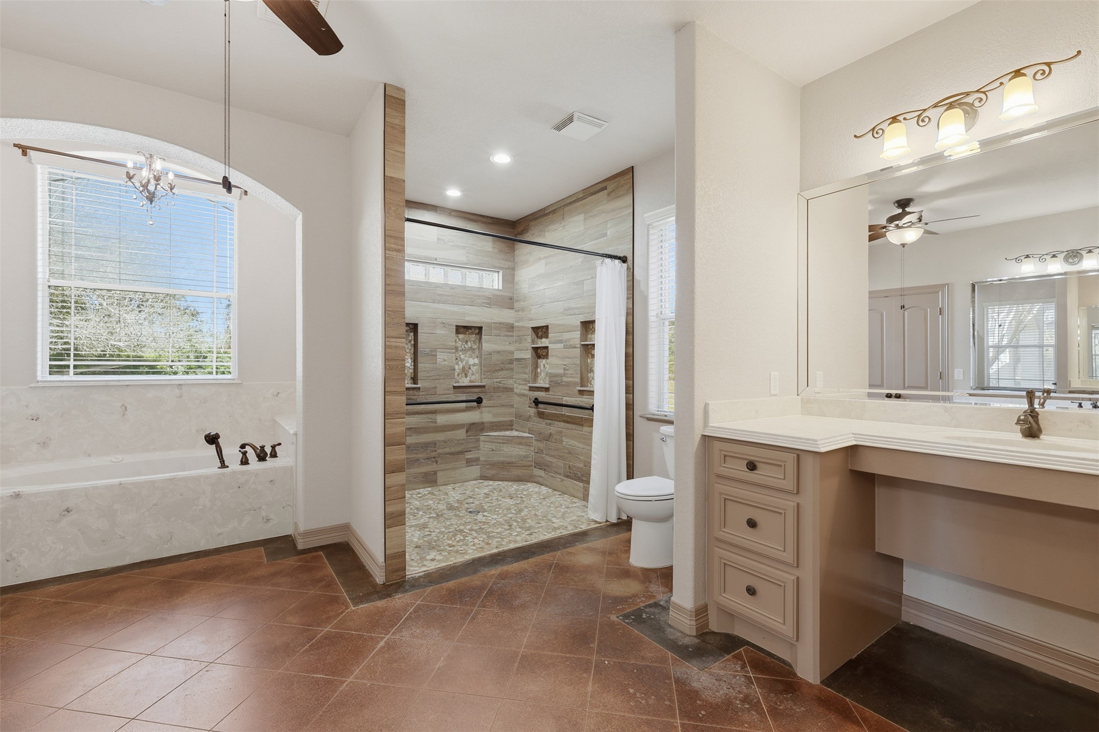 500 Burwell Road Highlands, TX 77562 - Photo 22 of 50 a bathroom with a tub a sink shower and mirror