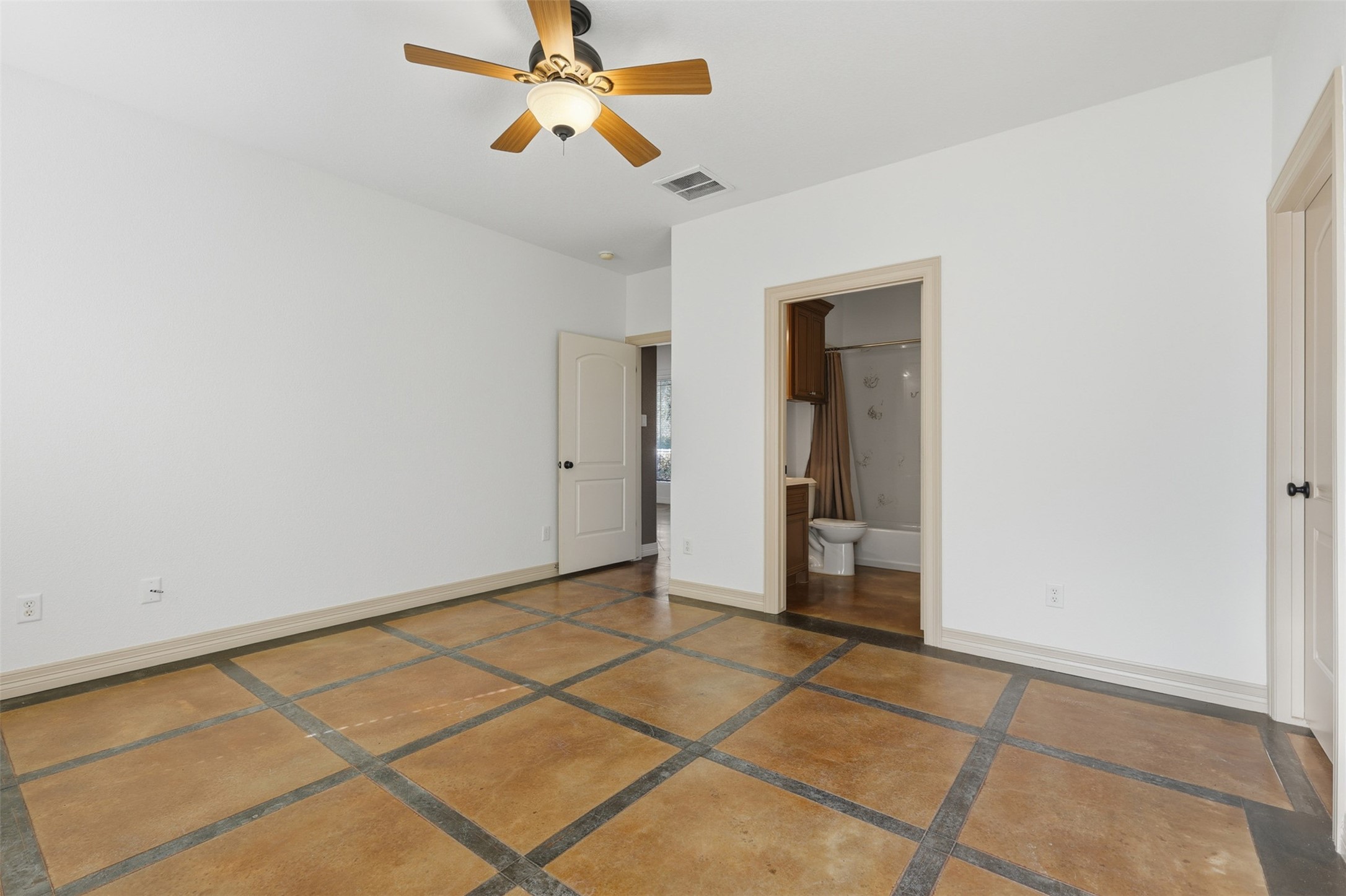 500 Burwell Road Highlands, TX 77562 - Photo 28 of 50 Well-appointed bedroom with its own bathroom, ceiling fan, and plenty of natural light throughout.