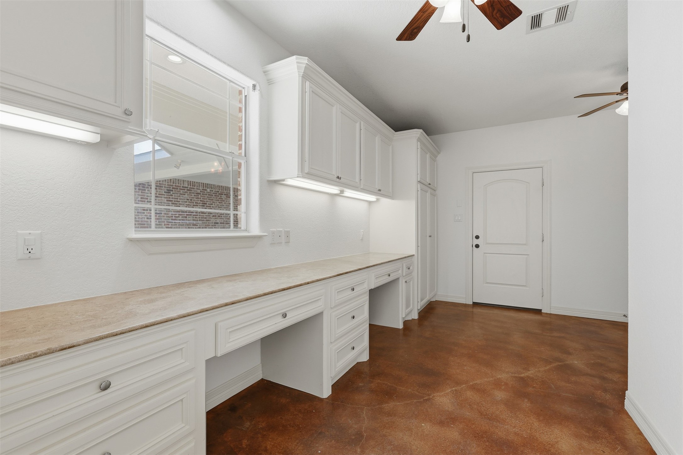 500 Burwell Road Highlands, TX 77562 - Photo 31 of 50 Super-sized laundry room with abundant storage, generous counter space, and built-in desk areas which are ideal for planning, homework, or a flexible workspace.