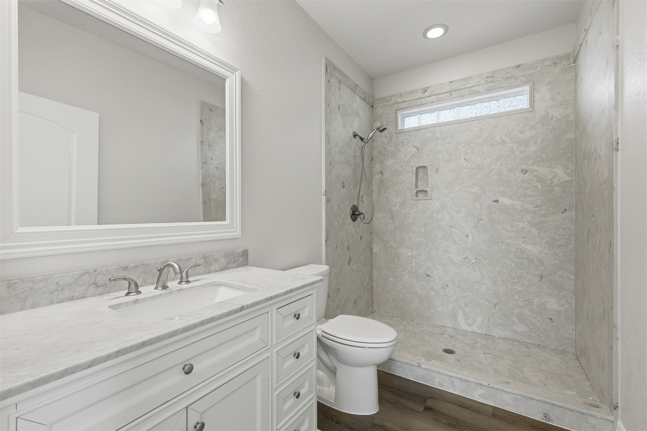 500 Burwell Road Highlands, TX 77562 - Photo 39 of 50 a bathroom with a granite countertop sink toilet and shower