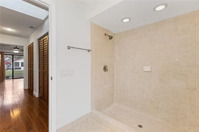 a view of a bathroom with a glass shower door