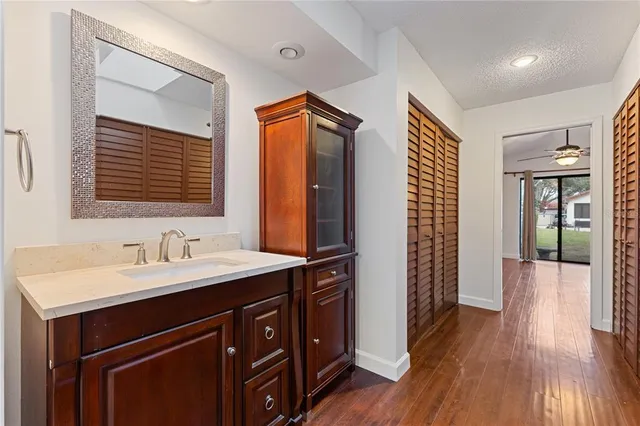 a bathroom with a sink a mirror and a shower