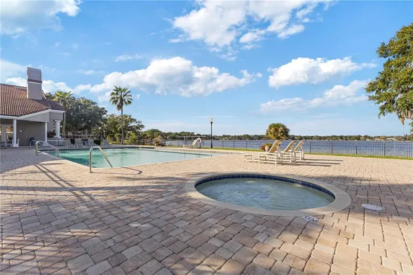 a view of swimming pool with outdoor seating