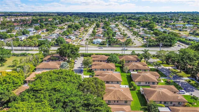 an aerial view of a house with a swimming pool