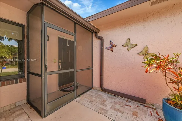 a view of a livingroom with furniture and hardwood floor
