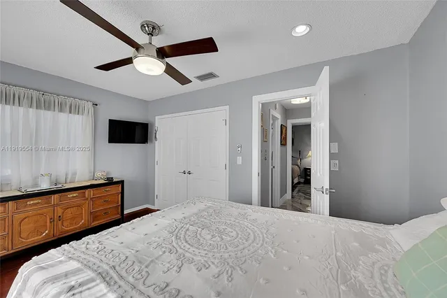 a bathroom with a sink toilet a mirror and shower