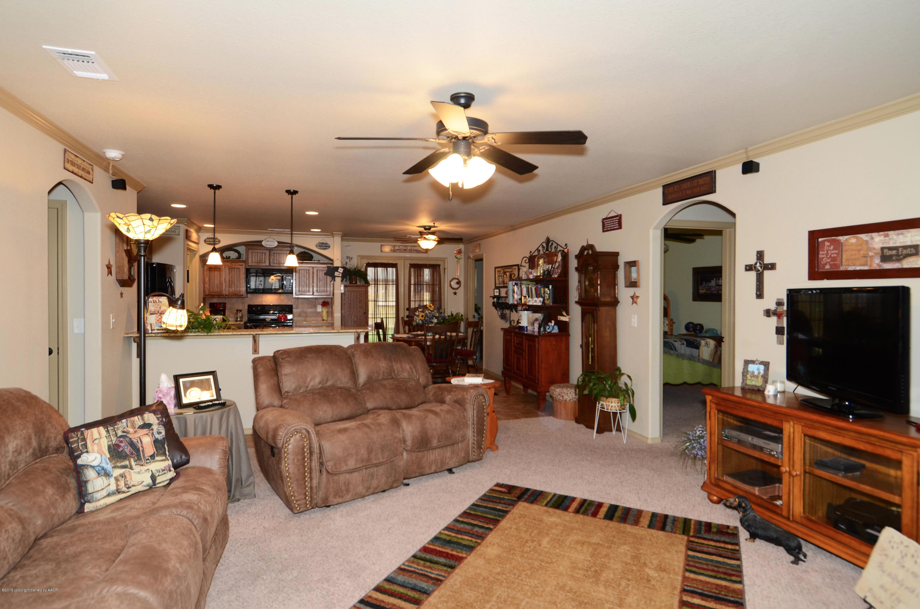 3705 Arden Road Amarillo, TX 79118 - Photo 3 of 20 a living room with furniture and a flat screen tv