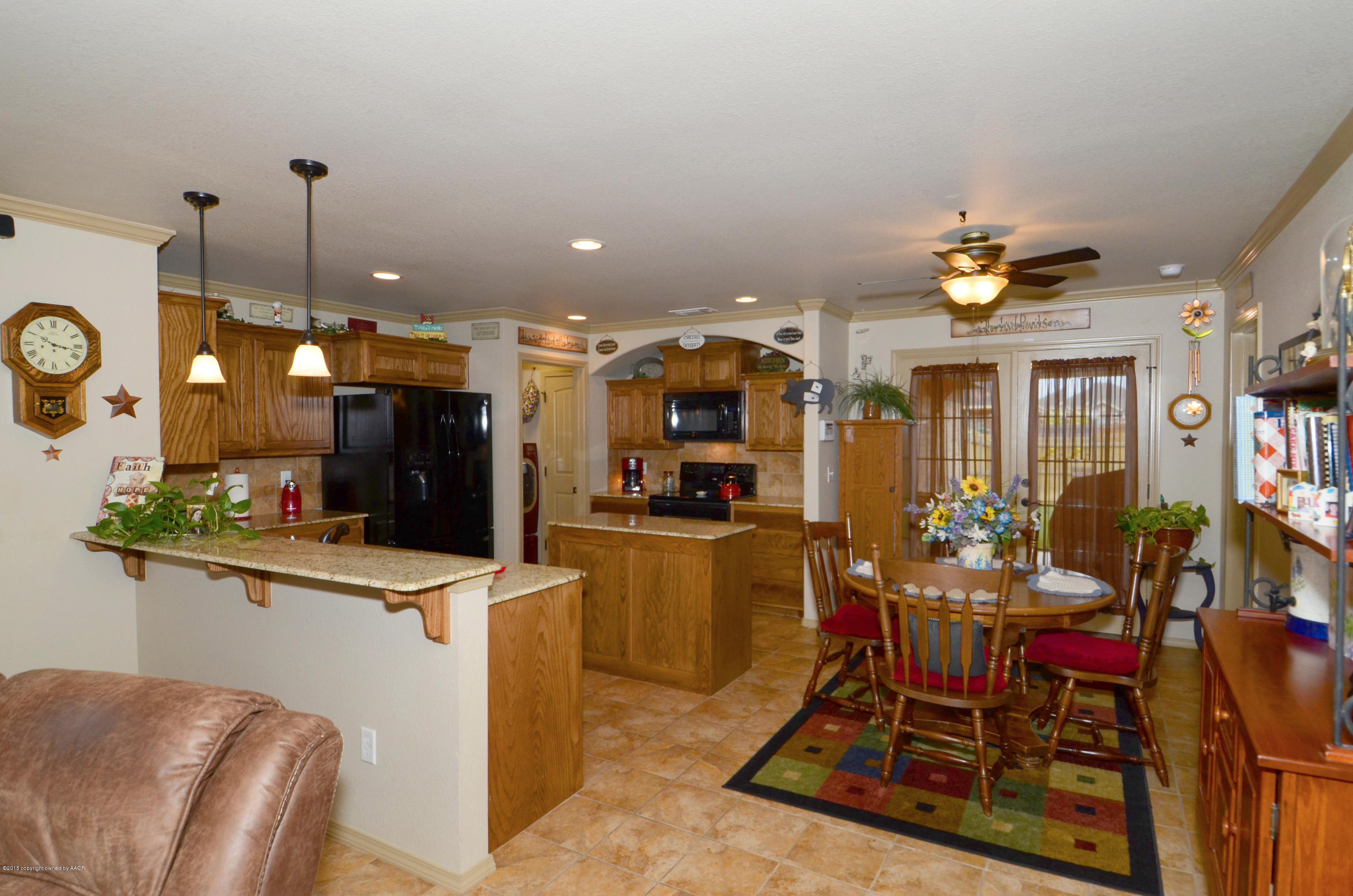 3705 Arden Road Amarillo, TX 79118 - Photo 7 of 20 a view of a dining room with furniture window and wooden floor