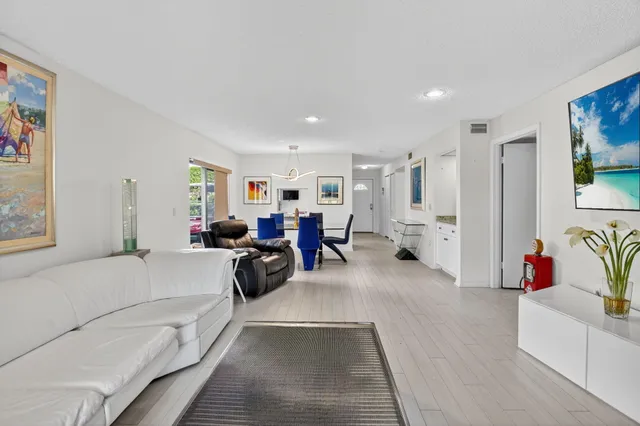 a spacious bedroom with two beds and a large window