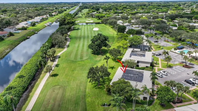 an aerial view of a house with a garden