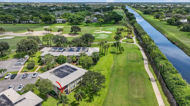 a view of a dining room with furniture and a kitchen