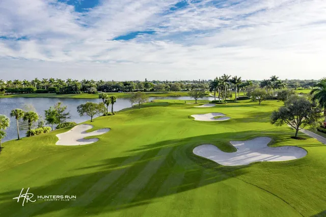 a view of a swimming pool with a yard