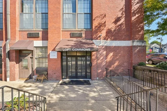 a outdoor space with patio the couches and a dining table with wooden floor